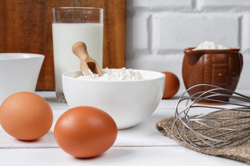 eggs milk flour and various ingredients for cooking in rustic style with copy space
