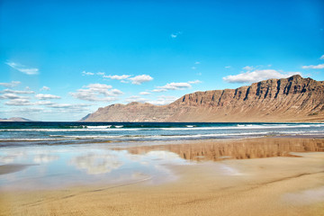 Landscape with volcanic hills and atlantic ocean in Lanzarote