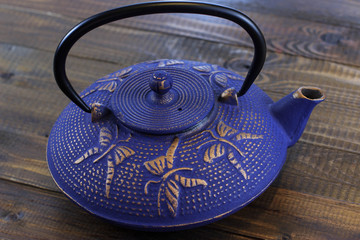 Blue Chinese cast iron teapot. Cooking utensils.