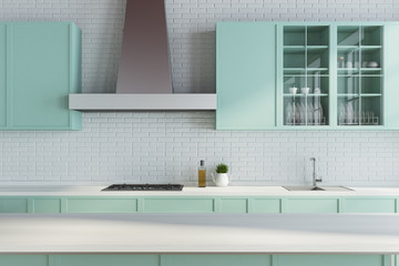 Fototapeta na wymiar Modern white kitchen, green countertops close up