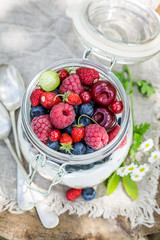 Closeup of healthy granola and yogurt with flowers