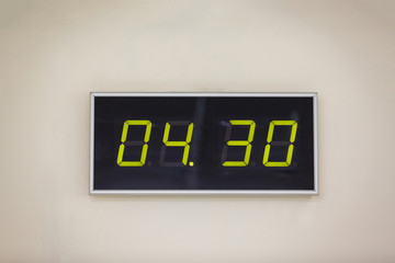 Black digital clock on a white background showing time 4 hours 30 minutes