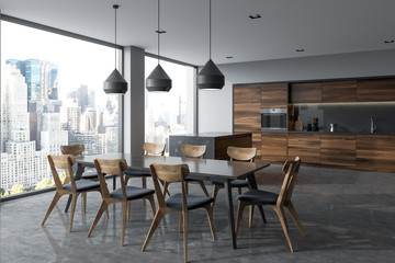 Dark gray dining table in a panoramic kitchen