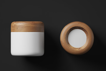 White and wooden cream jar, black background