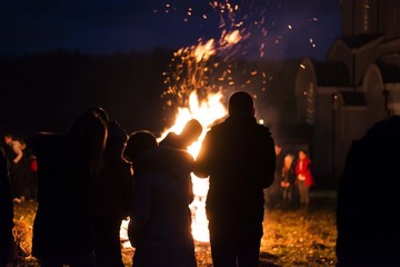 people silhouette near fire