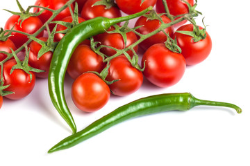 tomatoes and green peppers on a white background.