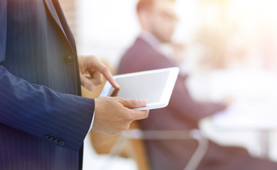 closeup.businessman working on tablet computer