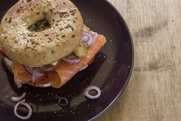 Whole Grain Bagel with salmon, cream cheese, onions and kosher pickle