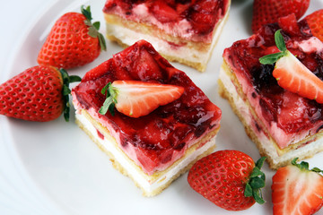 strawberry cake with fresh strawberries and whipped cream.