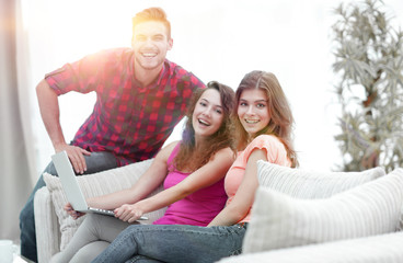 portrait of a group of young people sitting on the couch in the 