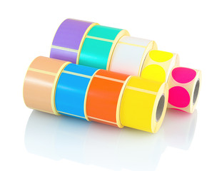 Colored label rolls isolated on white background with shadow reflection. Color reels of labels for...