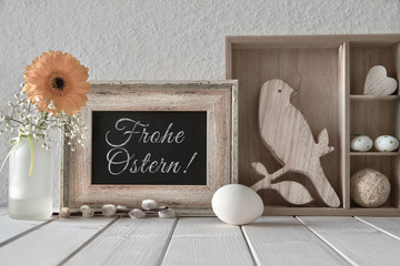 Springtime background: blackboard, display cabinet with Easter decorations and yellow gerbera, text