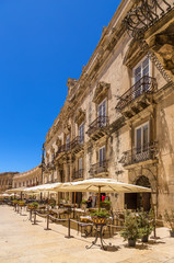 Fototapeta premium Syracuse, Italy. Baroque facade of the Palace of Benevento del Bosco on Cathedral Square on the island of Ortigia (wholly included in the UNESCO World Heritage List).