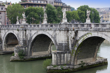 Italy. Rome. The bridge with sculptures over River Tiber to castle Saint Angelo..