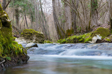 Fototapeta na wymiar The flow of water in the stream