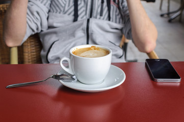 cup of coffee on a table in a cafe close-up