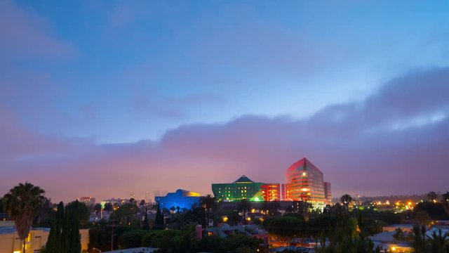 Scenic clouds rolling over Los Angeles cityscape twilight night 4K UHD Timelapse