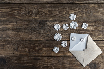 white envelope with flowers on white background.