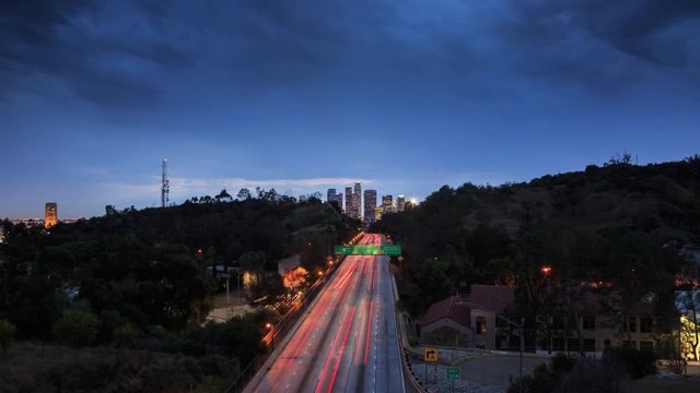 Freeway perspective downtown Los Angeles skyline 4K UHD timelapse hyperlapse.