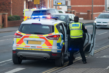 policeman entering vehicle