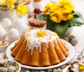 Easter yeast cake with icing and candied orange peel, delicious Easter dessert, traditional Easter...