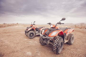 ATV Quad Bike in front of mountains landscape © Nastya Tepikina