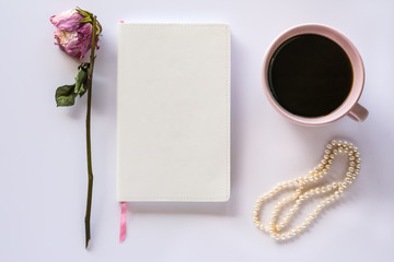 Vintage Design Notebook on Desk with Cup of Coffee