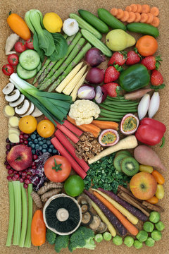 Healthy super food collection with fresh vegetables, fruit and nuts. Health food concept high in omega 3 fatty acids, antioxidants, anthocyanins, minerals, vitamins and  fibre.