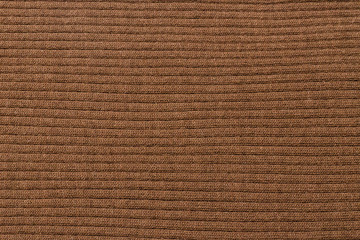 Brown ribbed texture. Knitted fabric