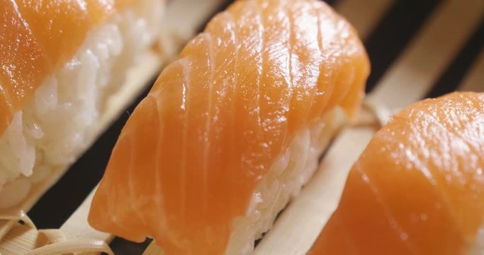 Macro shot of sushi, sashimi, uramaki and nighiri. typical Japanese dish consisting of rice, salmon or tuna,shrimp and fish eggs soaked in soy. Concept: Japanese restaurant, sushi, oriental tradition.