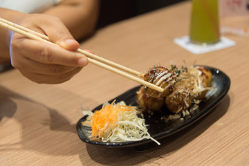 Chopstick holding Takoyaki 
