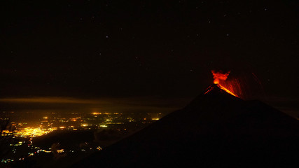 Volcan Fuego erupts at night, seen from Volcan Acatenango in Guatemala.