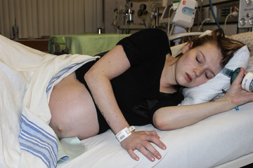 Young Woman in Maternity Labor Childbirth