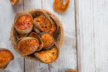 Dry Bael fruit - Slices of dry Bael fruit on the wooden table