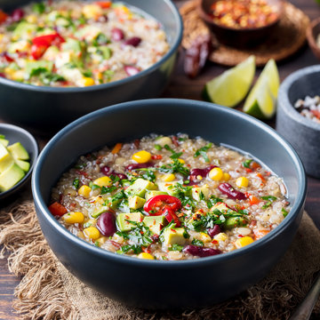Vegetable quinoa soup stew with avocado corn beans