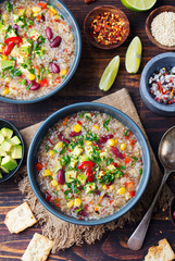 Vegetable quinoa soup with avocado, corn, beans.