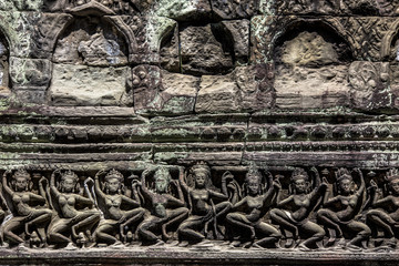 Siem Reap Angkor Wat apsara dancer ancient stone carving on wall and pillar
