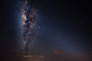 milkyway galaxy rise above lone tree at Kudat, Sabah Malaysia. Image contain soft focus, blur and noise due to long expose and high iso. Long expose and high iso setting need in night photo. 
