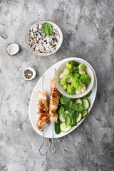 Chicken turkey skewers with fresh vegetables: spinach, hot pepper, romanesque, broccoflower, cherry tomatoes. Top view. Food concept