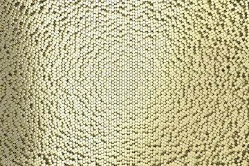 Pattern of brushed gold metal cylinders of different length