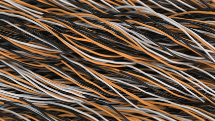 Twisted black, white and orange cables and wires on black surface