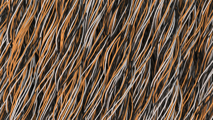 Twisted black, white and orange cables and wires on black surface