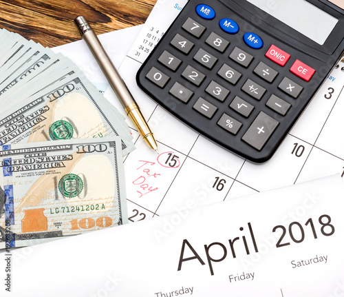 Money Calculator And Calendar On The Table Tax Time Concept Money Calculator And Calendar On The Table Tax Time Concept