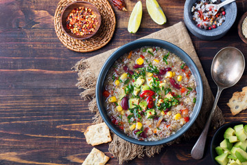 Vegetable quinoa soup stew with avocado corn beans