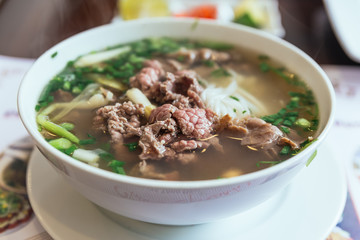 Beef Pho is a Vietnamese soup consisting of broth, rice noodles called bánh phở, a few herbs, and meat, primarily made with either beef or chicken.