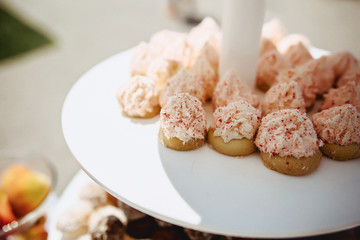delicious cakes and caps at the wedding banquet on the street ceremony