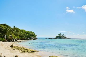 Fototapeta na wymiar Little granite Mouse island (Ile Souris), Anse Royal beach, island of Mahe, Seychelles, Indian Ocean