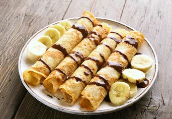 Crepes roll with banana slices