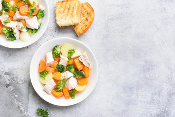 Diet chicken soup with carrot, broccoli, potato
