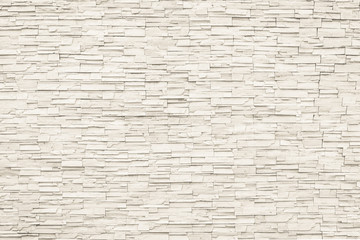 Mur de carreaux de brique de pierre de roche texture vieillie de fond détaillé en couleur marron beige crème
